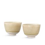 A pair of transparent-glazed whiteware cups, Sui - Tang dynasty 隋至唐 透明釉白瓷盃一對