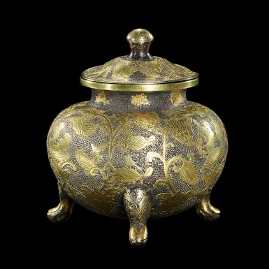 View full screen - View 1 of Lot 3678. A rare parcel-gilt silver tripod vessel and cover Tang dynasty | 唐 銀局部鎏金鏨花鳥紋三足蓋罐.