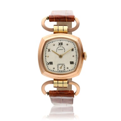 View full screen - View 1 of Lot 186. A pink gold cushion shaped wristwatch with hinged lugs, Circa 1945.