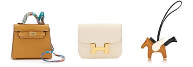 View full screen - View 1 of Lot 196. Set of 3 Jaune Foin Swift Kelly Charm Gold Hardware, 2022, Craie Epsom Constance Slim Wallet Gold Hardware, 2022, and Sesame, Black and Nata Milo Lambskin and Swift GriGri Rodeo Pegase Charm PM, 2021.