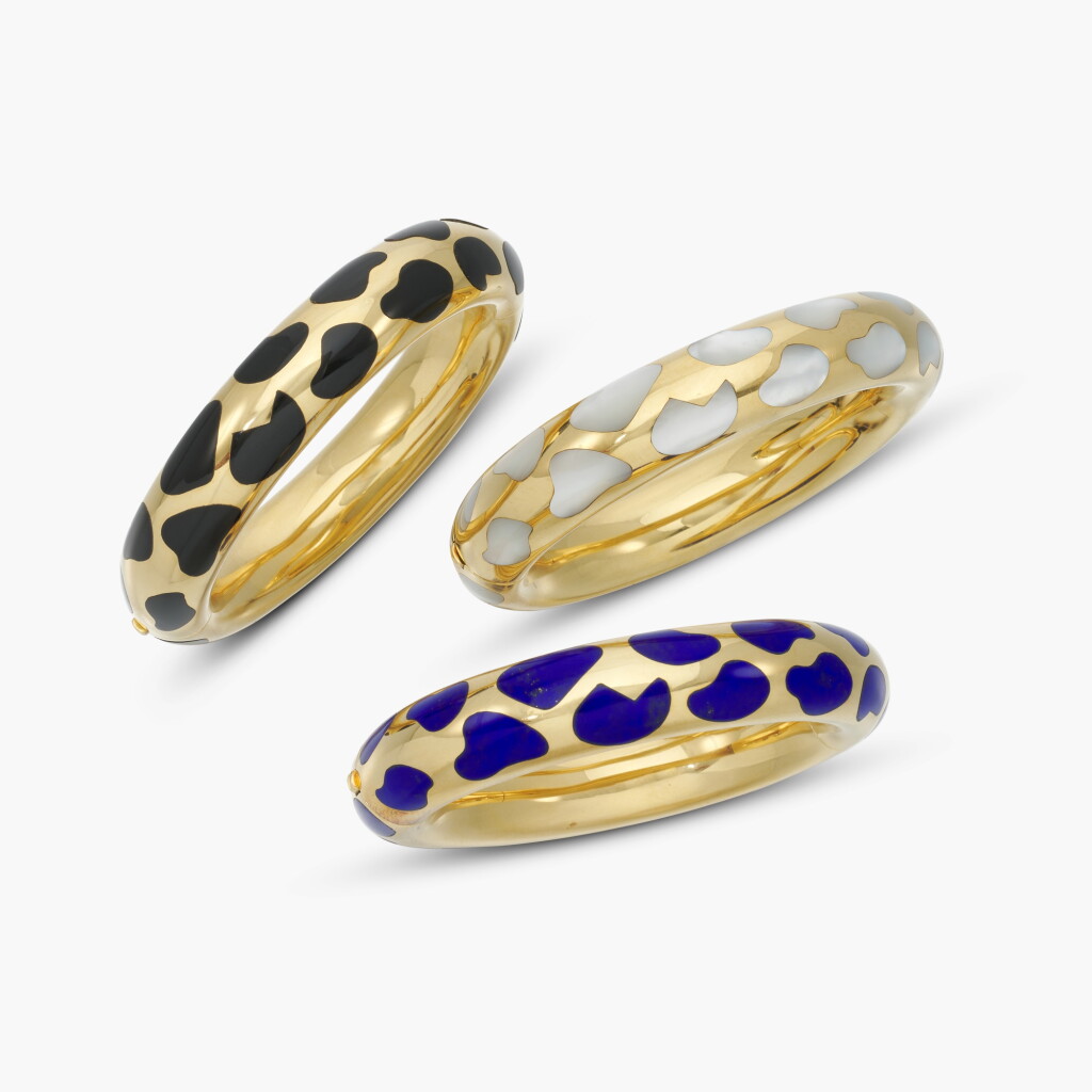 View full screen - View 1 of Lot 511. Three Mother-of-Pearl, Onyx and Lapis Lazuli Bangles .