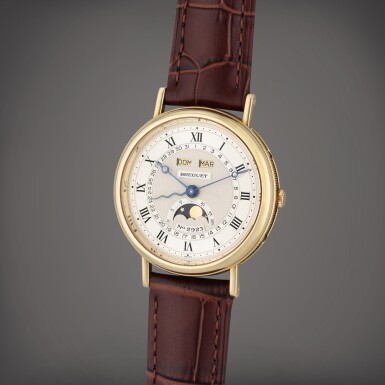 View full screen - View 1 of Lot 131. Reference 3040 Serpentine | A yellow gold triple calendar wristwatch with moon phases, Circa 1994.