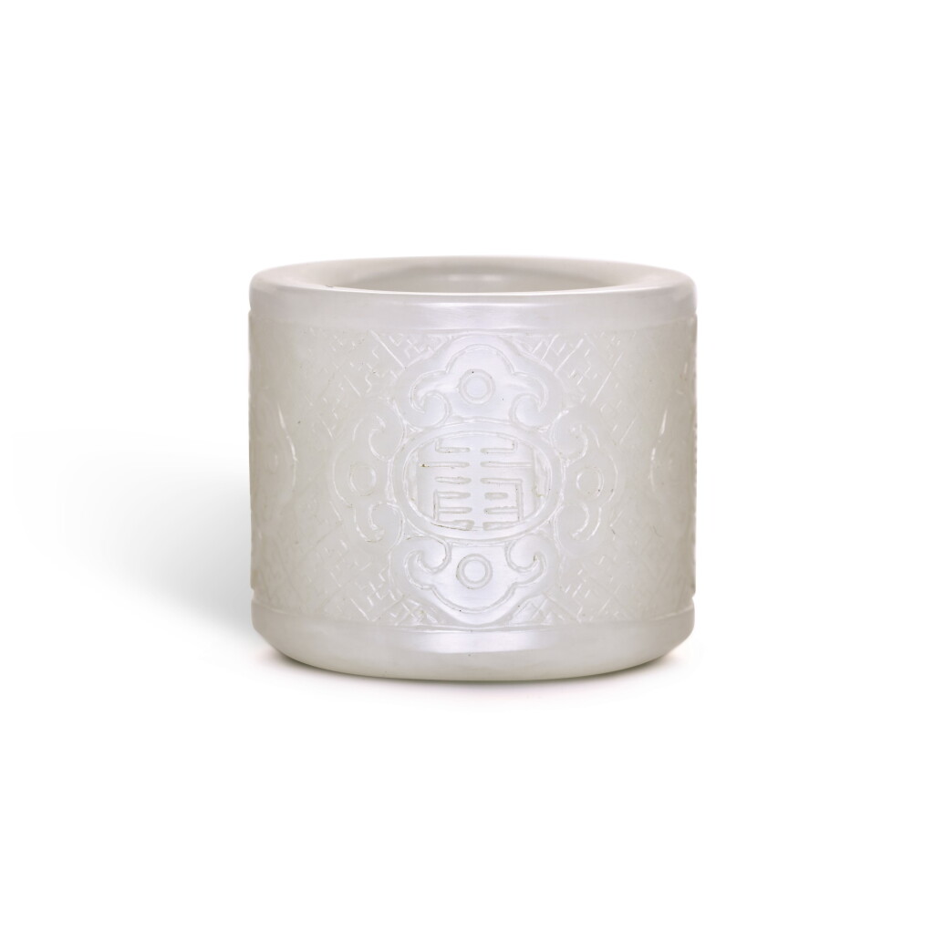 View full screen - View 1 of Lot 257. A WHITE JADE THUMB RING, JIAQING MARK AND PERIOD | 清嘉慶 白玉扳指 《嘉慶年製》款.