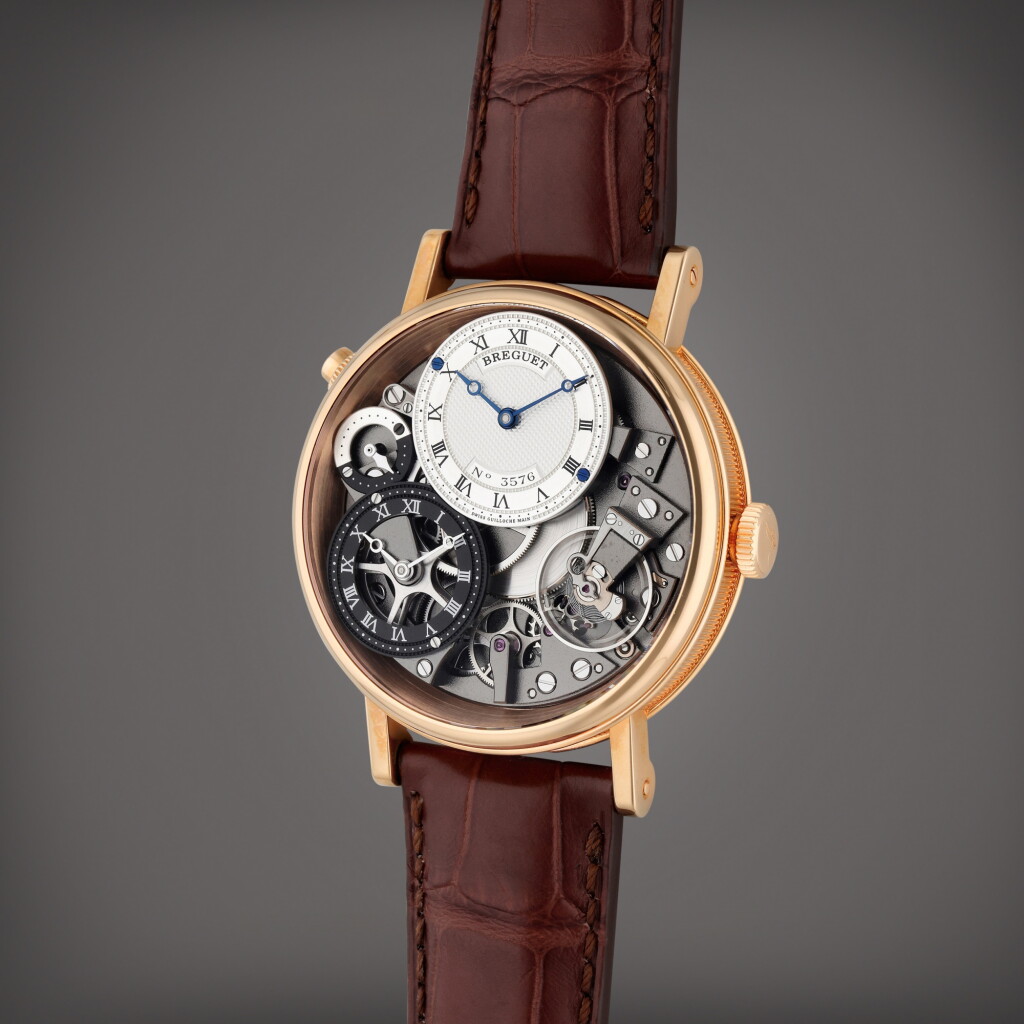 View full screen - View 1 of Lot 39. Reference 7067 Tradition GMT | A pink gold semi-skeletonized dual time wristwatch day/night indication, Circa 2014.