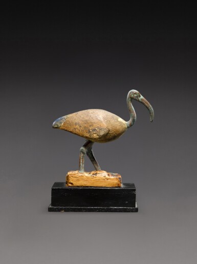 View full screen - View 1 of Lot 120. An Egyptian Bronze, Wood and Lapis Lazuli Figure of an Ibis, Late Period, 664-30 B.C..