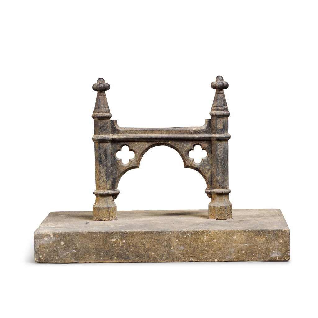 View full screen - View 1 of Lot 88. A REGENCY CAST-IRON BOOT-SCRAPER, FIRST QUARTER 19TH CENTURY, OF GOTHIC ARCHITECTURAL-FORM AND SET INTO A CUT-LIMESTONE BLOCK .