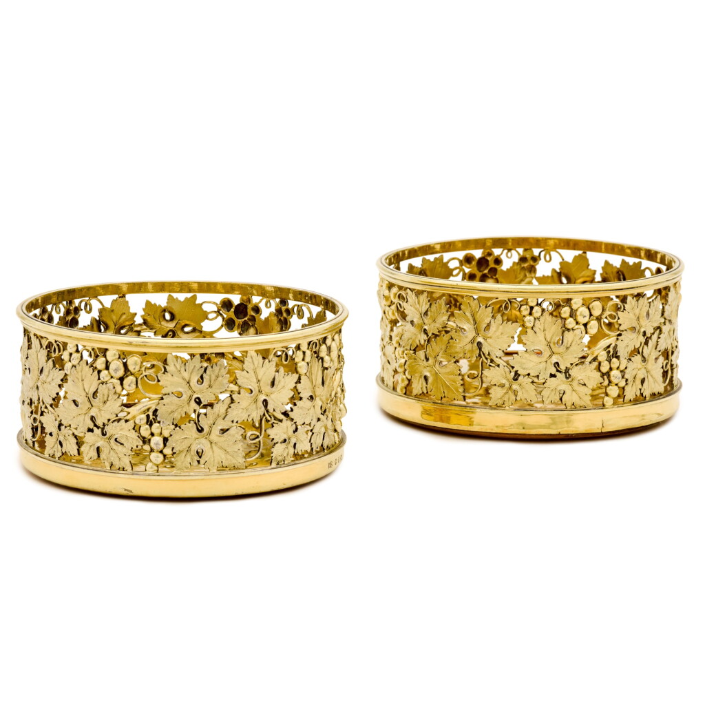 View full screen - View 1 of Lot 58. A pair of George III silver-gilt wine coasters, Benjamin Smith, London, 1808.