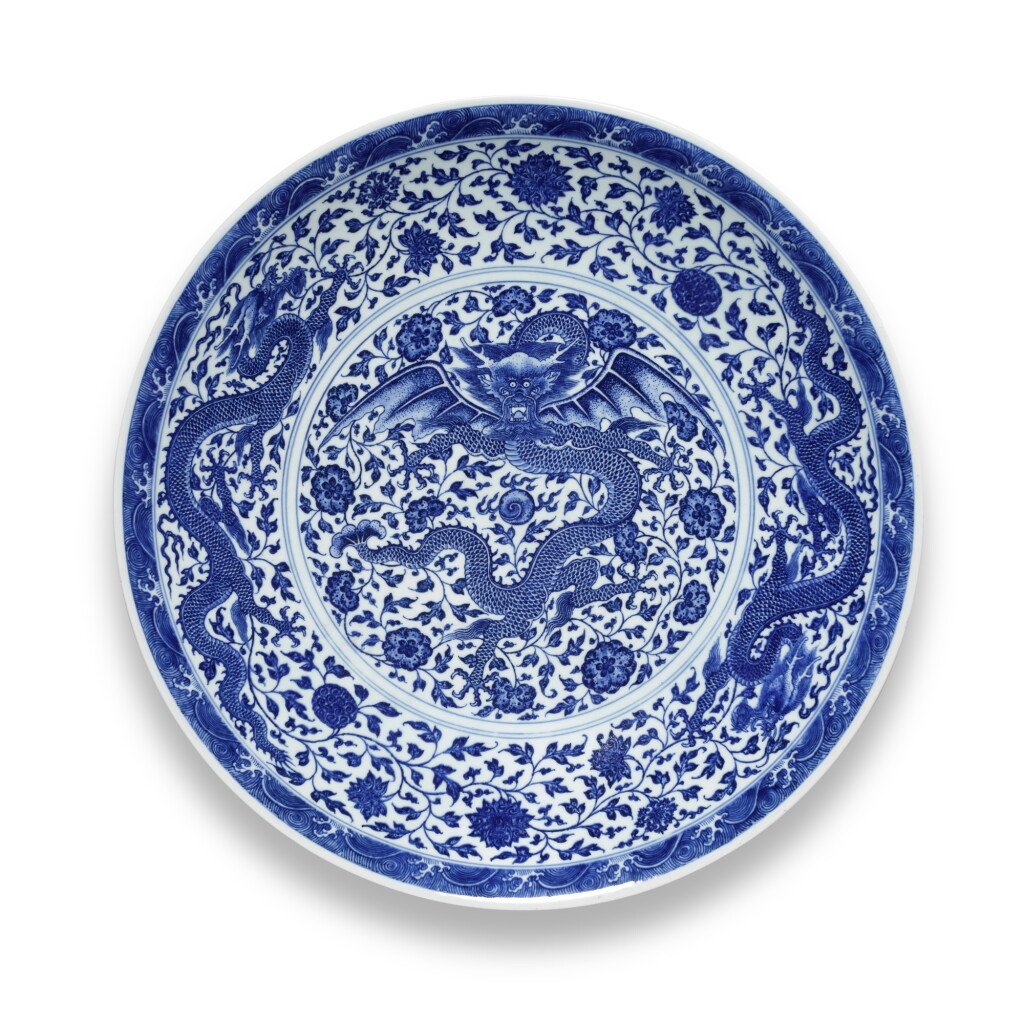 View full screen - View 1 of Lot 17. A finely painted and very large blue and white 'dragon' charger, Seal mark and period of Qianlong | 清乾隆 青花穿花遊龍紋大盤 《大清乾隆年製》款.