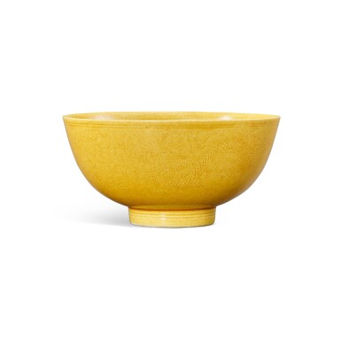 View full screen - View 1 of Lot 917. A fine yellow-glazed incised ‘dragon’ bowl, Seal mark and period of Daoguang | 清道光 黃釉暗刻雲龍趕珠紋盌 《大清道光年製》款.