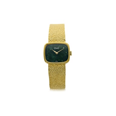 View full screen - View 1 of Lot 806. REFERENCE 6629 B 68 A YELLOW GOLD RECTANGULAR BRACELET WATCH WITH NEPHRITE DIAL, CIRCA 1980.