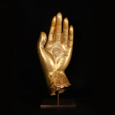 View full screen - View 1 of Lot 638. A massive gilt copper alloy fragmentary hand of a Buddhist figure, Tibet, circa 17th century.