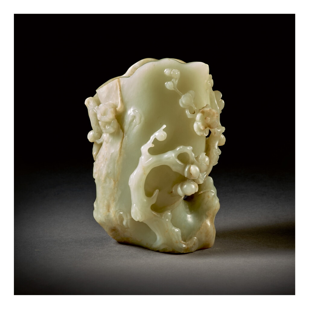 View full screen - View 1 of Lot 210. A PALE CELADON JADE 'PRUNUS' VASE, QING DYNASTY, 18TH CENTURY.