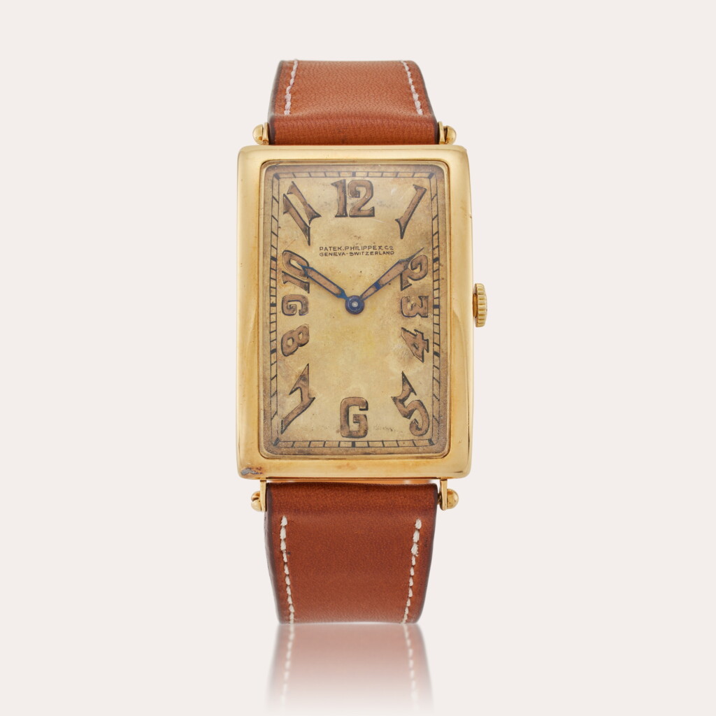 View full screen - View 1 of Lot 191. Retailed by The Grogan Company Pittsburgh: A yellow gold rectangular wristwatch, Made in 1913.