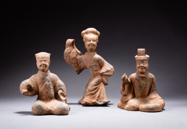 View full screen - View 1 of Lot 1. A group of three pottery figures of musicians, Han dynasty | 漢 陶俑一組三件.