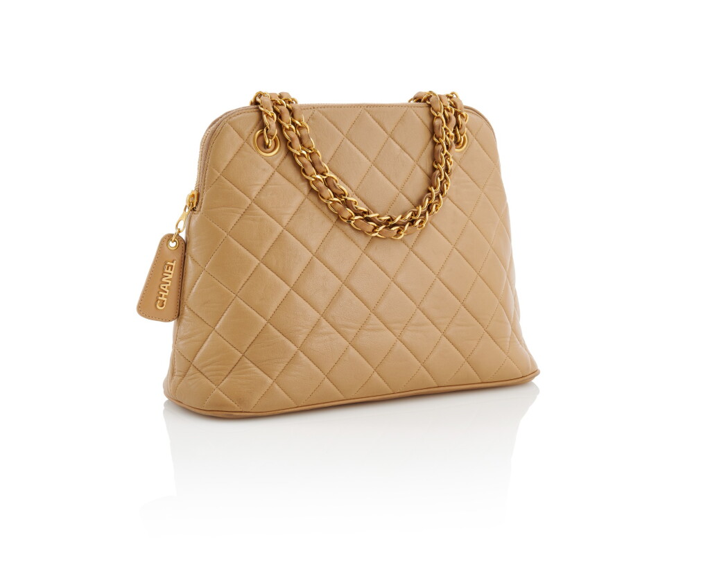 View full screen - View 1 of Lot 144. CHANEL | BEIGE LEATHER WITH GOLD-TONE METAL SHOPPER .