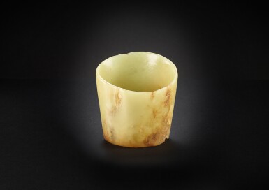 View full screen - View 1 of Lot 3783. A yellowish-celadon jade hoof-shaped ornament, Neolithic period, Hongshan Culture | 新石器時代 紅山文化 青玉馬蹄管形器.