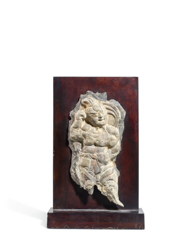 View full screen - View 1 of Lot 2007. A limestone fragmentary relief of a guardian, Tang dynasty | 唐 石灰岩雕力士殘像.