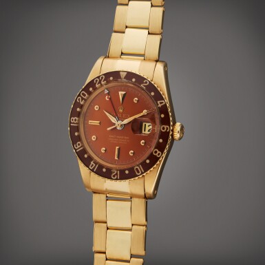View full screen - View 1 of Lot 42. Reference 6542 GMT-Master | A yellow gold automatic dual time zone wristwatch with date, bracelet, and bakelite bezel, Circa 1958 | 勞力士 型號 6542 GMT-Master 黃金自動上鏈兩地時間腕錶備日期顯示,配鍊帶及人造樹膠錶圈,製作年份約 1958.