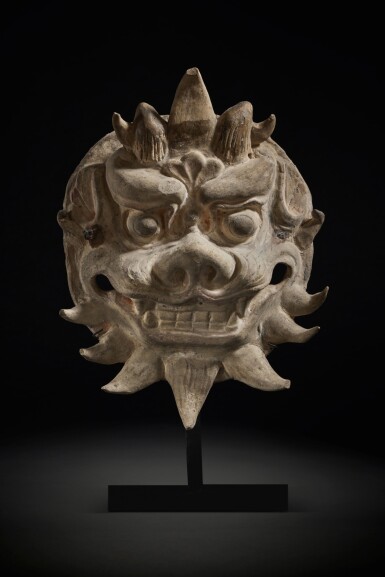 View full screen - View 1 of Lot 181. A molded pottery 'monster' mask, Six Dynasties.