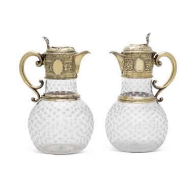 View full screen - View 1 of Lot 93. Two Victorian silver-gilt-mounted claret jugs, William & George Sissons, Sheffield, 1865 and 1867.