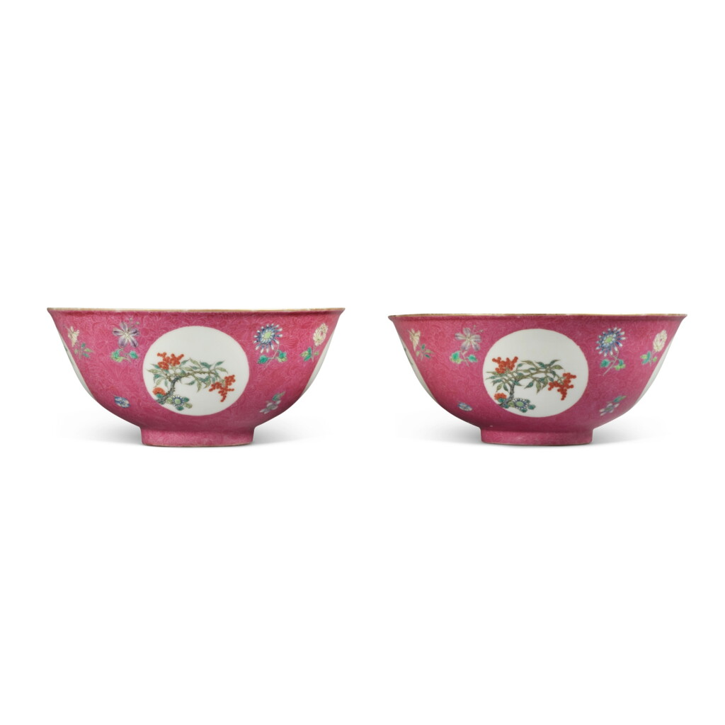 View full screen - View 1 of Lot 832. A pair of ruby-ground famille-rose sgraffiato 'medallion' bowls, Republic period | 民國 胭脂紅地軋道粉彩開光花卉圖盌一對.