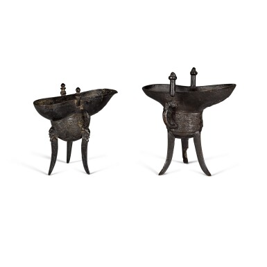 View full screen - View 1 of Lot 40. Two inscribed and dated archaistic bronze tripod vessels, jue One dated Jiajing mark and period, the other dated third year of the Qianlong reign (corresponding to 1738) | 清乾隆三年(1738年)銅仿古爵 及 明嘉靖 銅仿古爵 一組兩件.