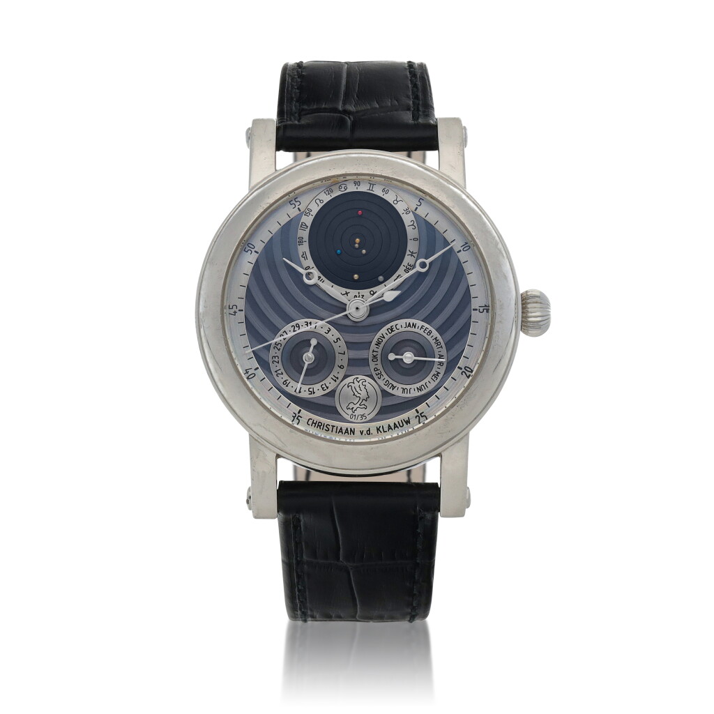 View full screen - View 1 of Lot 590. Planetarium 2000 Limited edition platinum wristwatch with month, date, and planetarium aperture depicting the relative placement of the planets around the sun Circa 2000.
