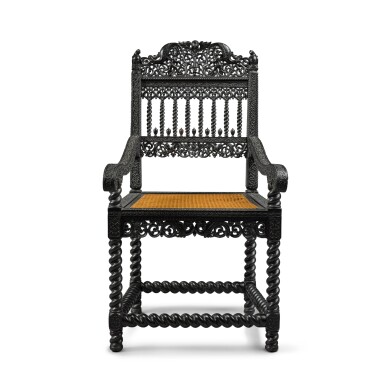 View full screen - View 1 of Lot 4. An Indo-Dutch carved ebony armchair, probably Coromandel Coast, circa 1660-80 .