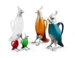 A group of five Spanish silver and glass decanters (one silver-plated), modern | Groupe de cinq aiguières en forme d'oiseau en verre coloré montées en argent, Espagne, moderne