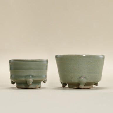 View full screen - View 1 of Lot 5786. Two Longquan celadon-glazed incense burners, Yuan - Ming dynasty | 元至明 龍泉青釉三足爐兩件.