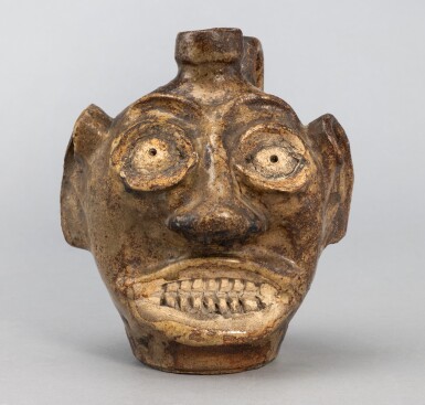 View full screen - View 1 of Lot 870. Highly Important and Rare Alkaline-Glazed Stoneware and Kaolin Clay Face Jug, Edgefield District, South Carolina, Circa 1867-1885.