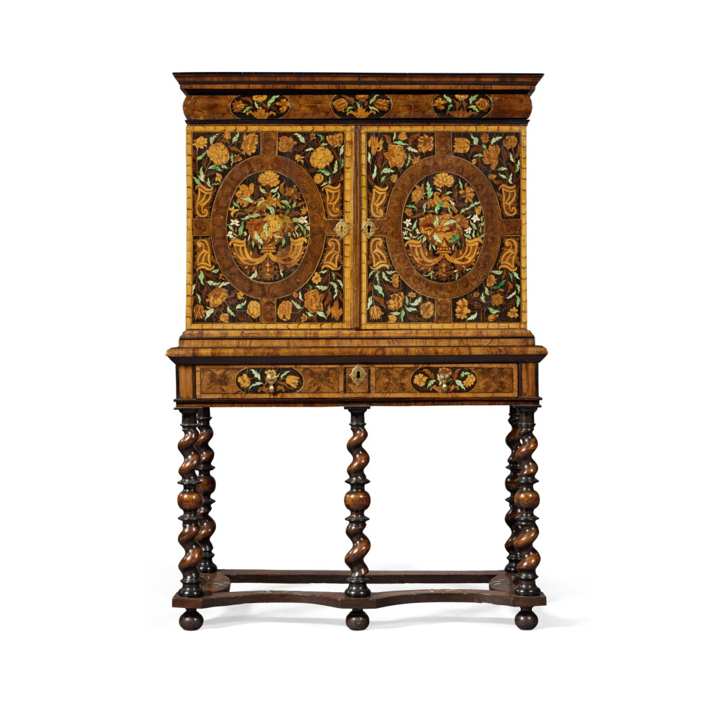 View full screen - View 1 of Lot 241. A William and Mary Oyster-Veneered Walnut, Olivewood, Ebony, Fruitwood, Ivory and Green-Stained Bone Marquetry Cabinet on Stand, Circa 1690.