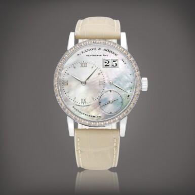 View full screen - View 1 of Lot 2181. Little Lange 1 Soirée, Reference 813.037 | A limited edition white gold and cognac diamond-set wristwatch with digital date display, power reserve indication and mother-of-pearl dial, Circa 2010 | 朗格 | LITTLE LANGE 1 SOIRÉE 型號813.037 | 限量版白金鑲棕色彩鑽腕錶,備數位日期、動力儲備顯示及珠母貝錶盤,約2010年製.