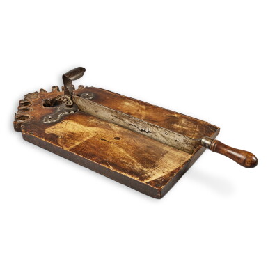 View full screen - View 1 of Lot 582. A French Provincial Carved Walnut Coupe-Pain (Bread Cutter), 18th Century.