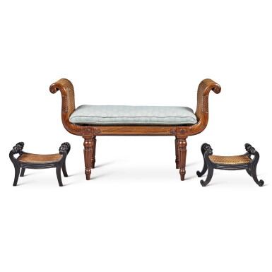 View full screen - View 1 of Lot 593. A Near Pair of Solid Ebony Anglo-Indian Caned Footstools together with a George IV Brass-Inlaid Mahogany Caned Window Seat, Second Quarter 19th Century.