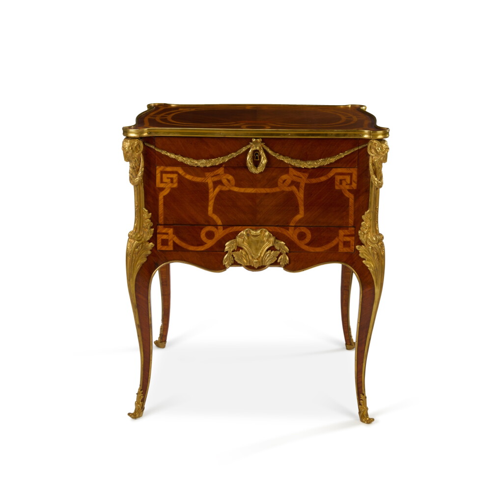 View full screen - View 1 of Lot 100. A French Transition style gilt-bronze mounted amaranth and kingwood table à écrire, by Paul Sormani after a model by Jean-Francois Oeben, Paris, late 19th century | Schreibtisch im Stile Transition aus Amarant, Palisander und mit vergoldeten Bronzefassungen, von Paul Sormani nach einem Modell von Jean-Francois Oeben, Paris, Ende 19. Jh..
