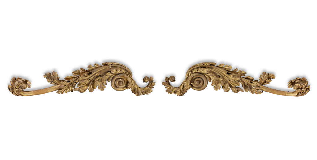 View full screen - View 1 of Lot 183. An extraordinary pair of large late Regency carved giltwood scrolled surmounts for a window, niche or other architectural conceit, circa 1820, attributed to Gillows.