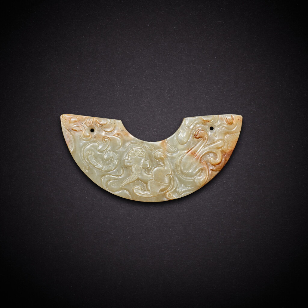 View full screen - View 1 of Lot 3525. A pale celadon 'chilong' pendant, huang, Song dynasty | 宋 青白玉螭龍紋璜.
