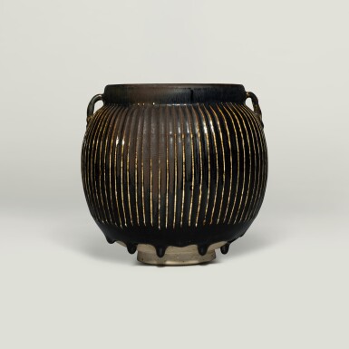 View full screen - View 1 of Lot 143. A black-glazed 'ribbed' handled jar, Northern Song / Jin dynasty.
