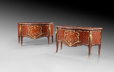 View full screen - View 1 of Lot 28. An arlequin pair of gilt bronze mounted amaranth and tulipwood marquetry commodes, Louis XV, one stamped Mewesen | Deux commodes formant paire en marqueterie florale, d'amarante et bois de rose, d'époque Louis XV, une estampilllée Mewesen.