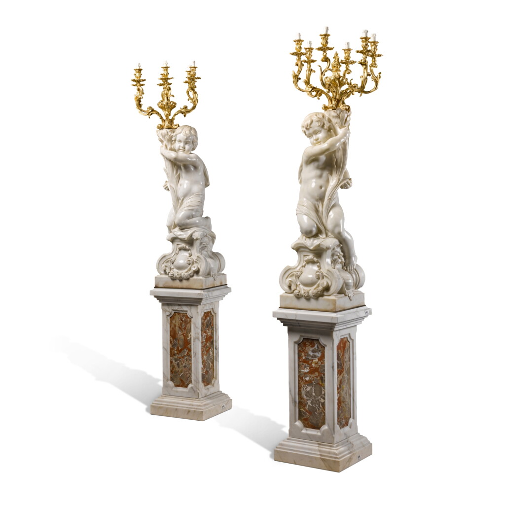View full screen - View 1 of Lot 77. A pair of French white marble and gilt-bronze figural candelabra.