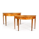 A pair of George III satinwood and tulipwood-banded demi-lune console tables, circa 1780, possibly by Mayhew and Ince