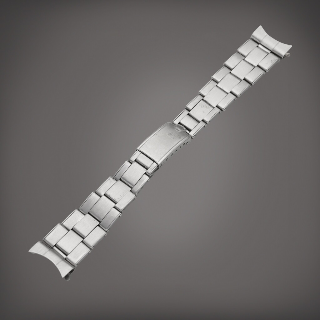View full screen - View 1 of Lot 436. A stainless steel Rolex bracelet with folding clasp and end links, Circa 1950.