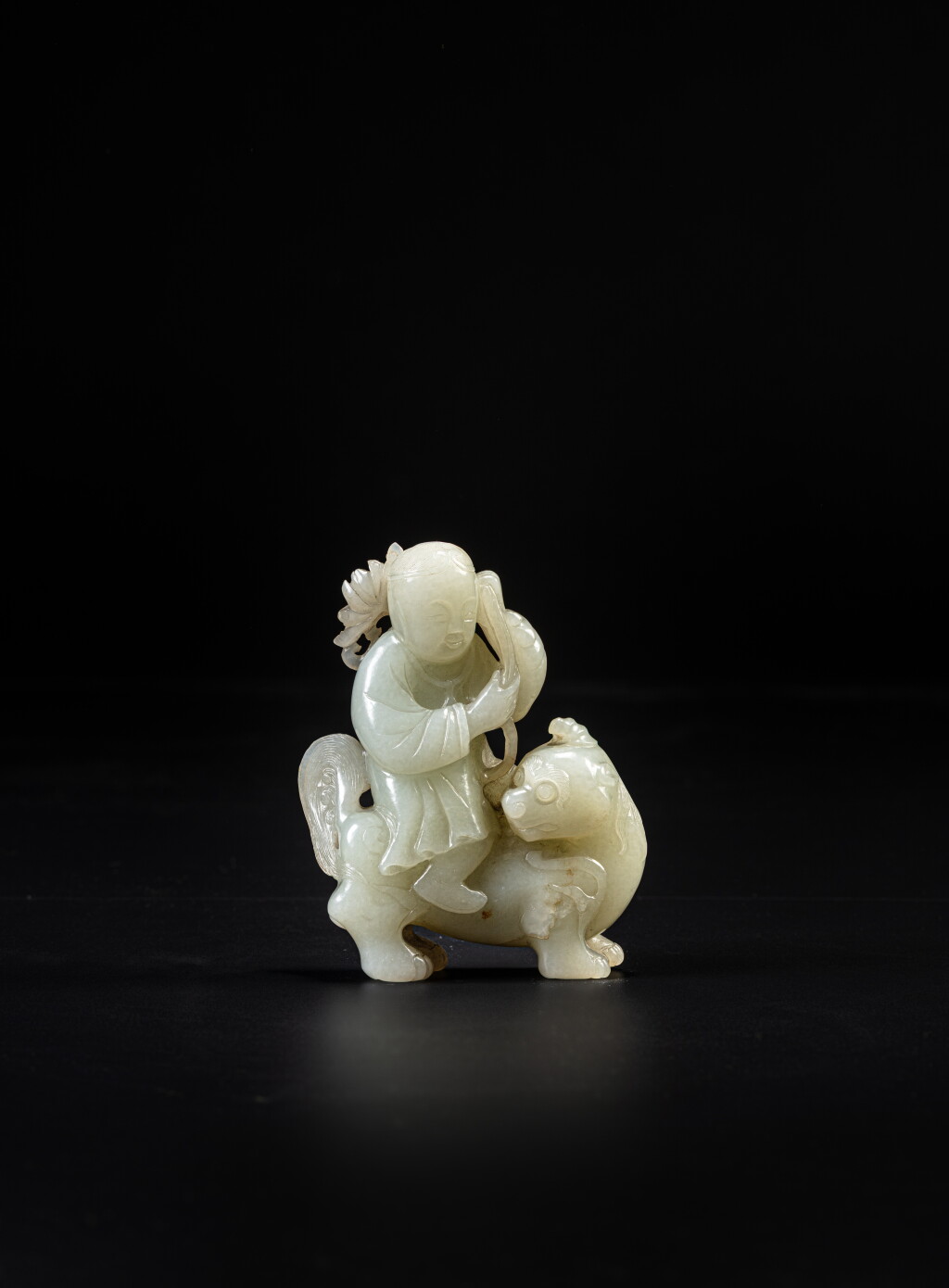 View full screen - View 1 of Lot 137. A celadon jade 'immortal riding a lion' group, Qing dynasty, 18th / 19th century.