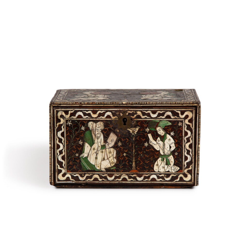 View full screen - View 1 of Lot 86. A miniature casket, India, Gujarat or Sindh, Mughal, early 17th century | Petit Cabinet à abattant en teck, bois exotiques, ivoire naturel et ivoire teinté, laiton et argent, Inde, Sind ou Gujarat, moghole, début du XVIIe siècle.
