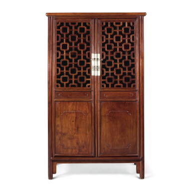 View full screen - View 1 of Lot 111. A HUANGHUALI TWO DOOR CABINET, QING DYNASTY, 19TH CENTURY | 清十九世紀 黃花梨海棠紋圓角立櫃.