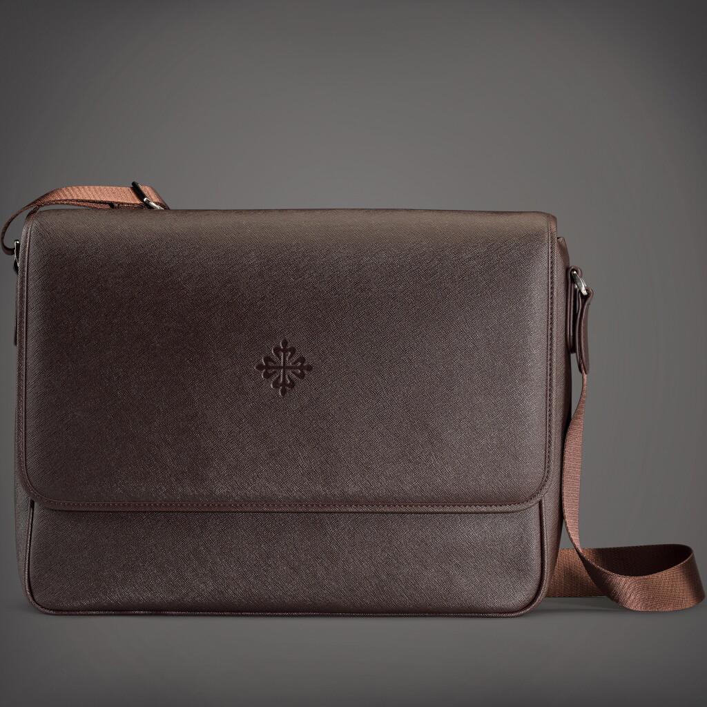 View full screen - View 1 of Lot 80. A brown Saffiano leather messenger bag | Circa 2018.