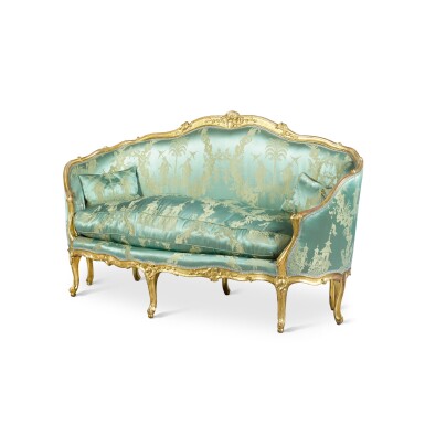 View full screen - View 1 of Lot 33. A Louis XV carved giltwood canapé en gondole, mid-18th century, in the manner of Jean-Baptiste Tilliard.