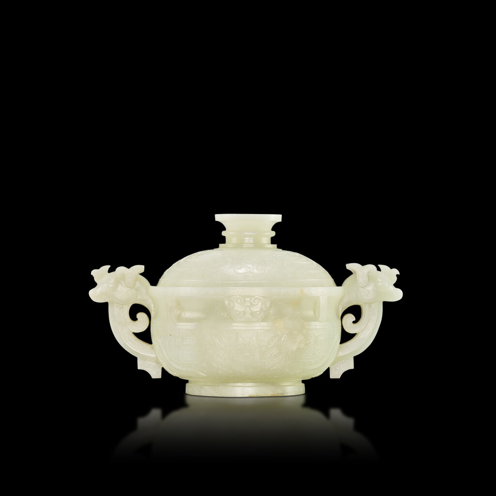 View full screen - View 1 of Lot 3658. A white jade archaistic gui-form vessel and cover, Mark and period of Qianlong | 清乾隆 白玉仿古獸面紋雙龍耳蓋簋 《乾隆年製》款.