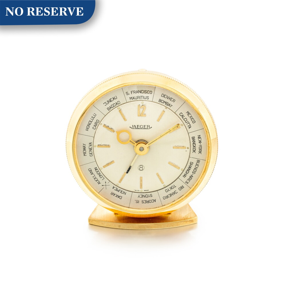 View full screen - View 1 of Lot 612. JAEGER-LECOULTRE | A GILT BRASS WORLD TIME ALARM CLOCK WITH 8 DAYS POWER RESERVE, CIRCA 1970 .